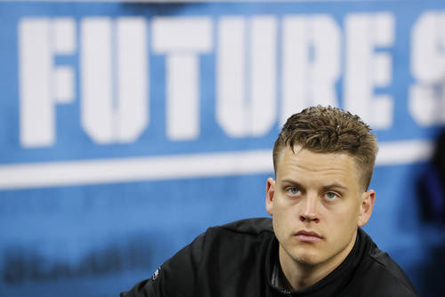 LSU quarterback Joe Burrow watches a drill at the NFL football scouting combine in Indianapolis ...