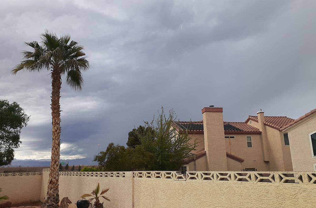 Dark clouds form near South Eastern Avenue and Windmill Lane in Las Vegas on Easter Sunday, Apr ...