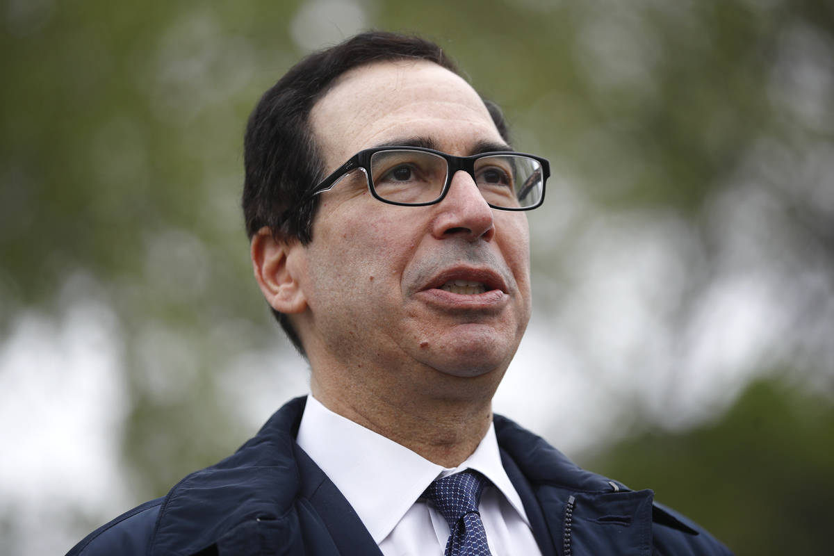 Treasury Secretary Steve Mnuchin speaks with reporters about economic impacts of the coronaviru ...