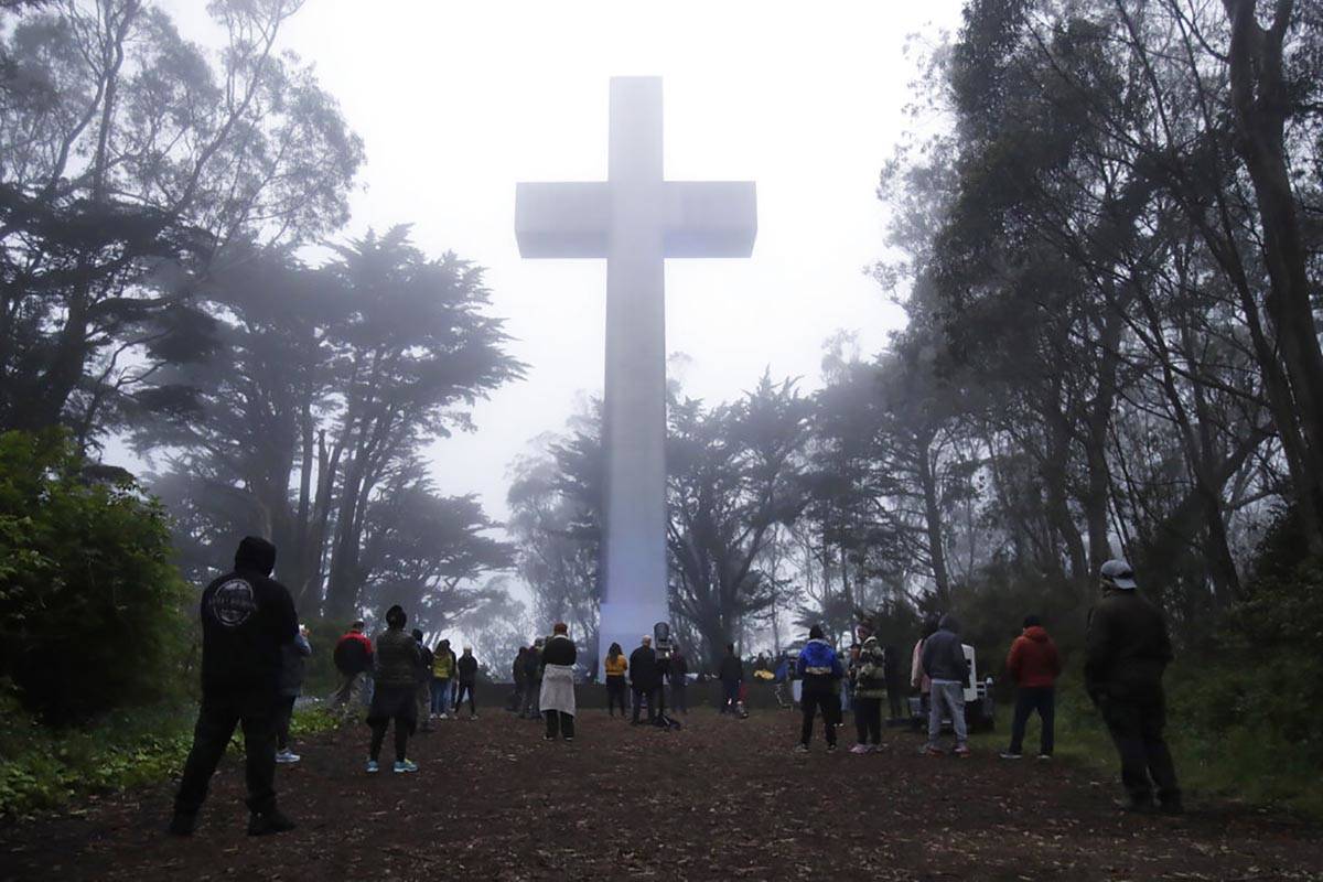 People gather at the Mount Davidson cross in San Francisco, Sunday, April 12, 2020. Mount David ...
