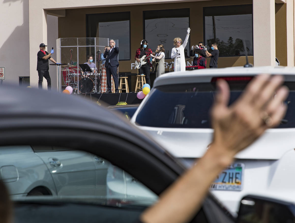 Guests attend an Easter service in the parking lot at International Church of Las Vegas in Las ...