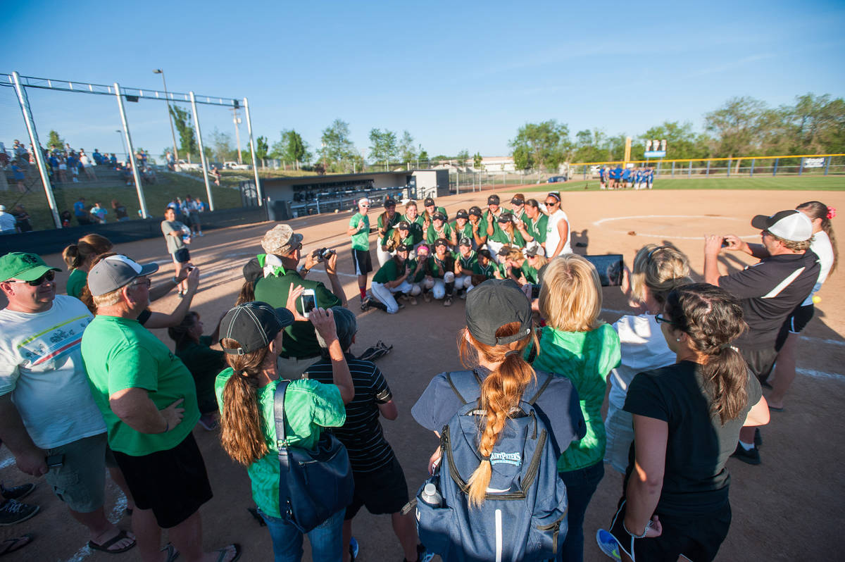 Palo Verde players pose for photos from family members after the team defeated Reed in the seco ...