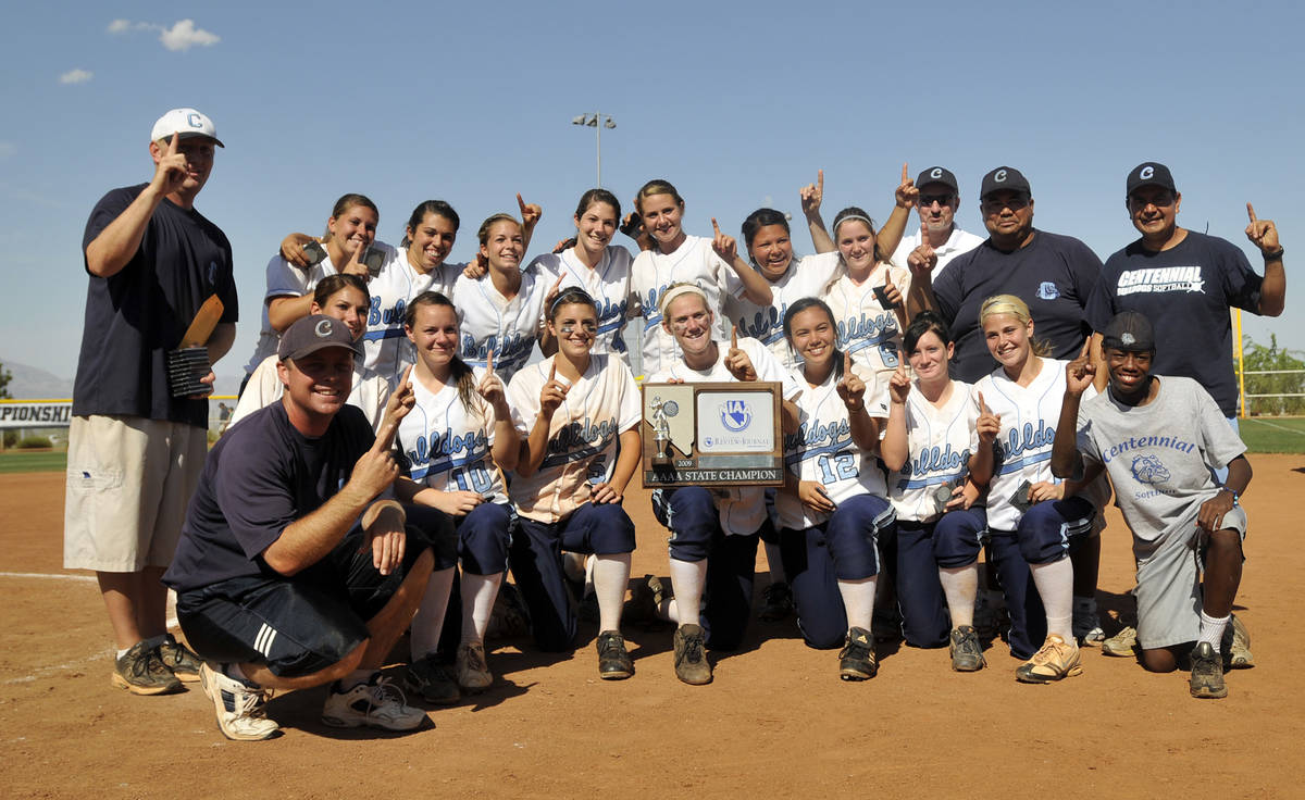 Centennial High School's softball team with coaches celebrates in a team photo after winning th ...
