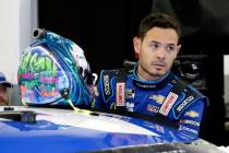 FILE - In this Feb. 14, 2020, file photo, Kyle Larson gets ready to climb into his car to pract ...