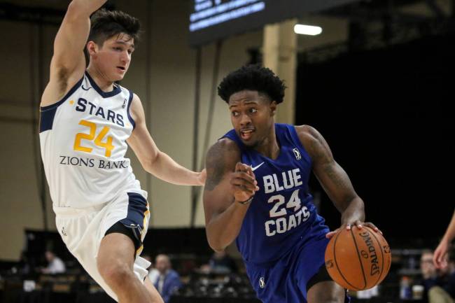 Delaware Blue Coats' Haywood Highsmith (24) drives past Salt Lake City Stars' Grayson Allen (24 ...