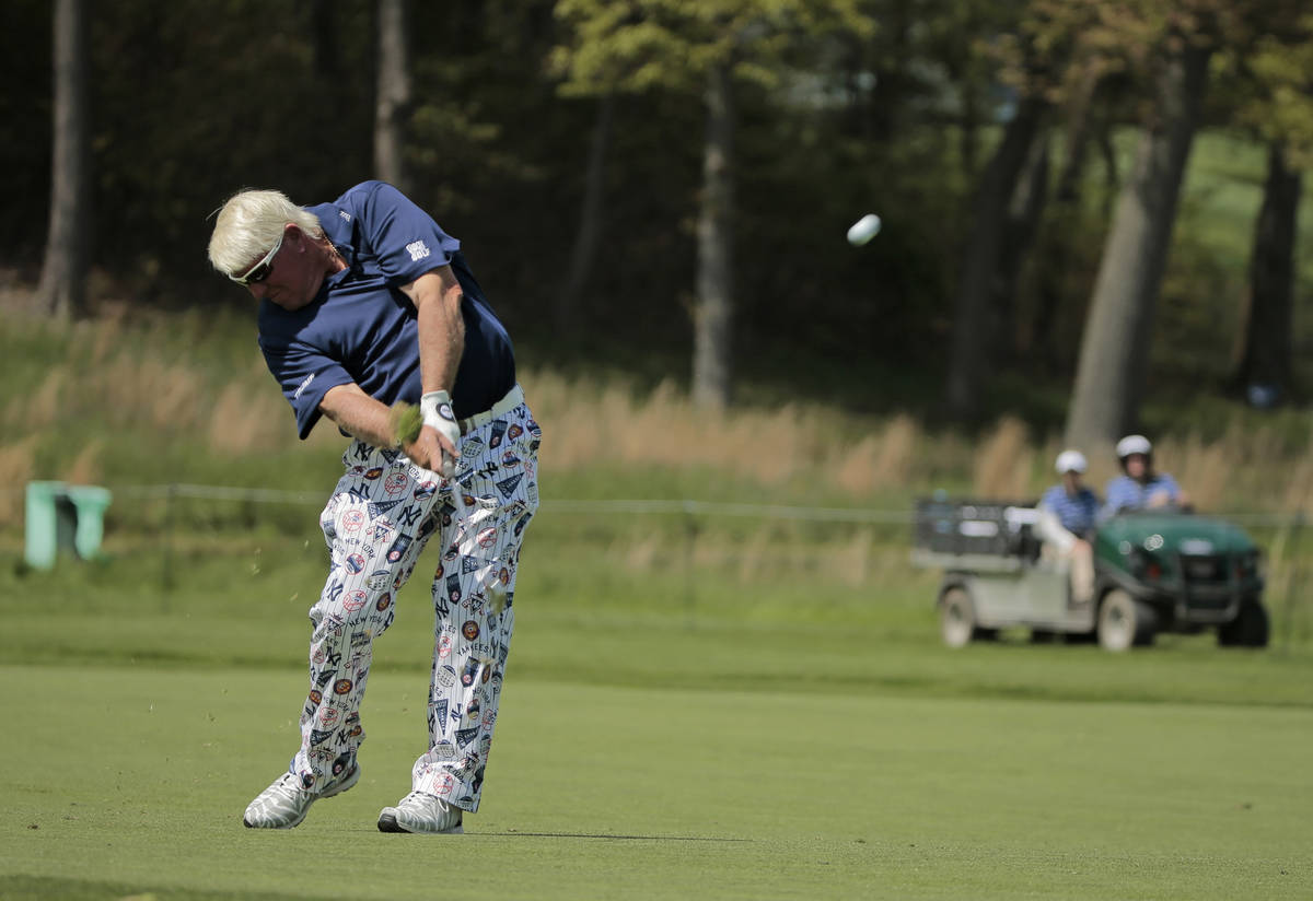 John Daly hits off the 16th fairway during the first round of the PGA Championship golf tournam ...