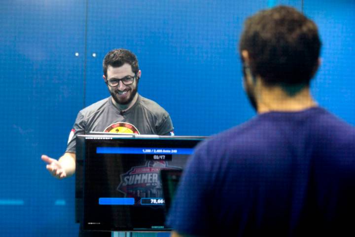 Phil Galfond, left, with the San Francisco Rush, reacts while playing video poker against Tim A ...
