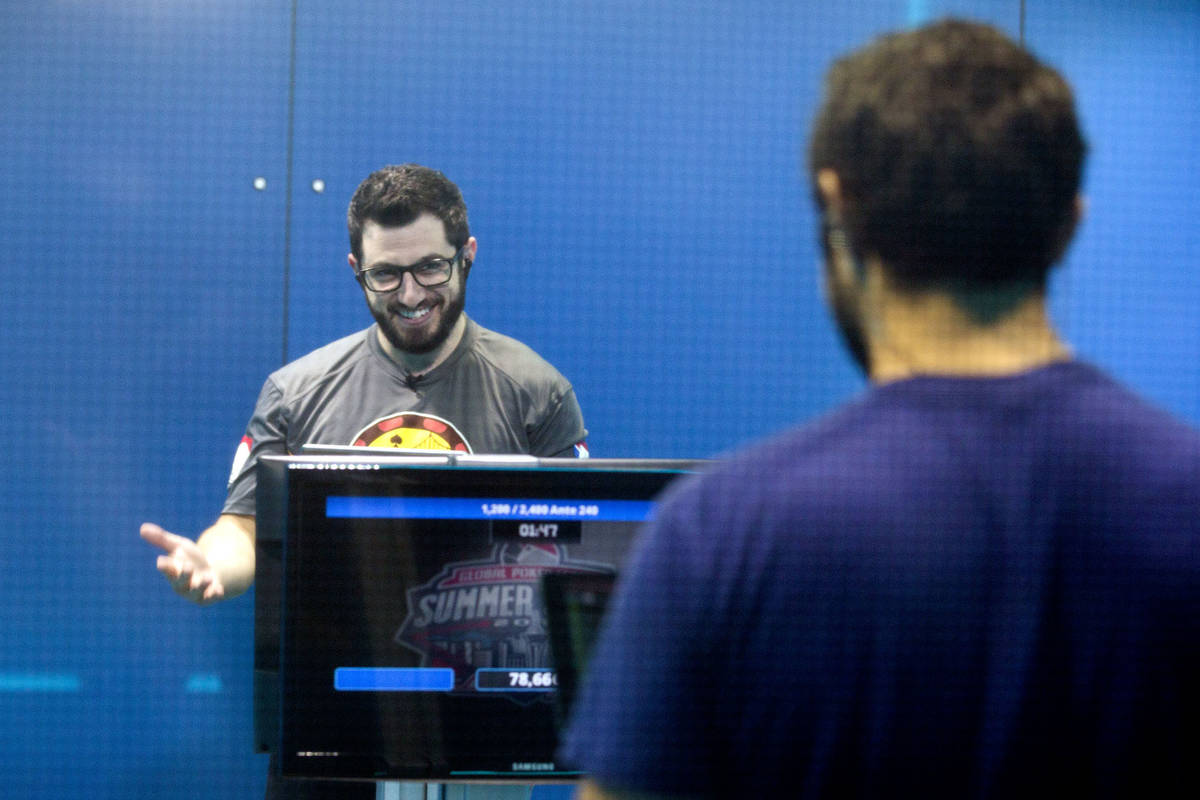 Phil Galfond, left, with the San Francisco Rush, reacts while playing video poker against Tim A ...