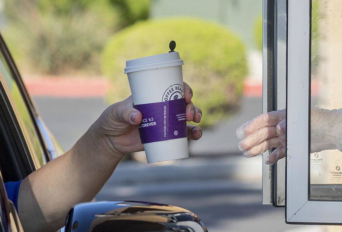 A driver for Postmates pickups up an order at the Coffee Bean & Tea Leaf located on 6115 S ...