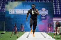Louisville offensive lineman Mekhi Becton runs a drill at the NFL football scouting combine in ...