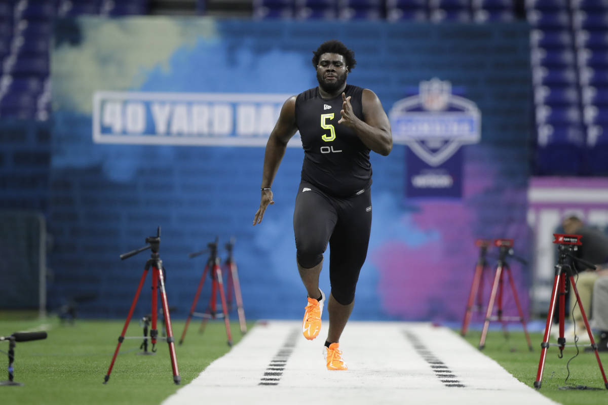 Louisville offensive lineman Mekhi Becton runs the 40-yard dash at the NFL football scouting co ...