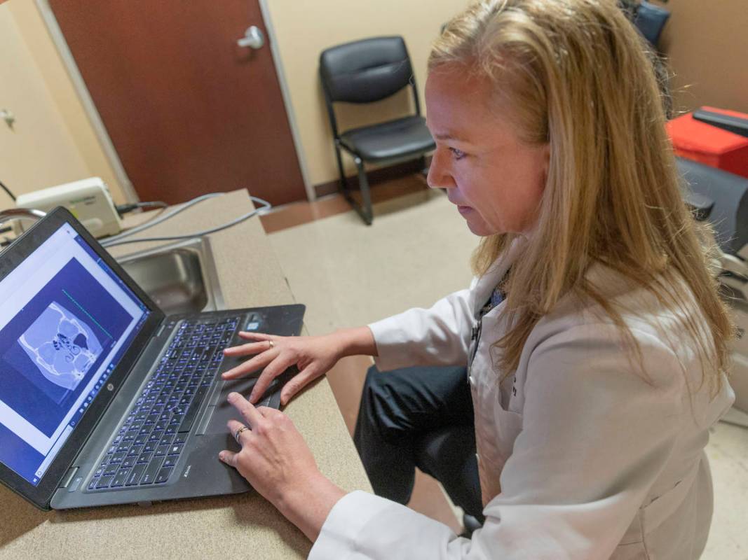 Dr. Tina Elkins, assistant professor of general otolaryngology at UNLV School of Medicine, demo ...