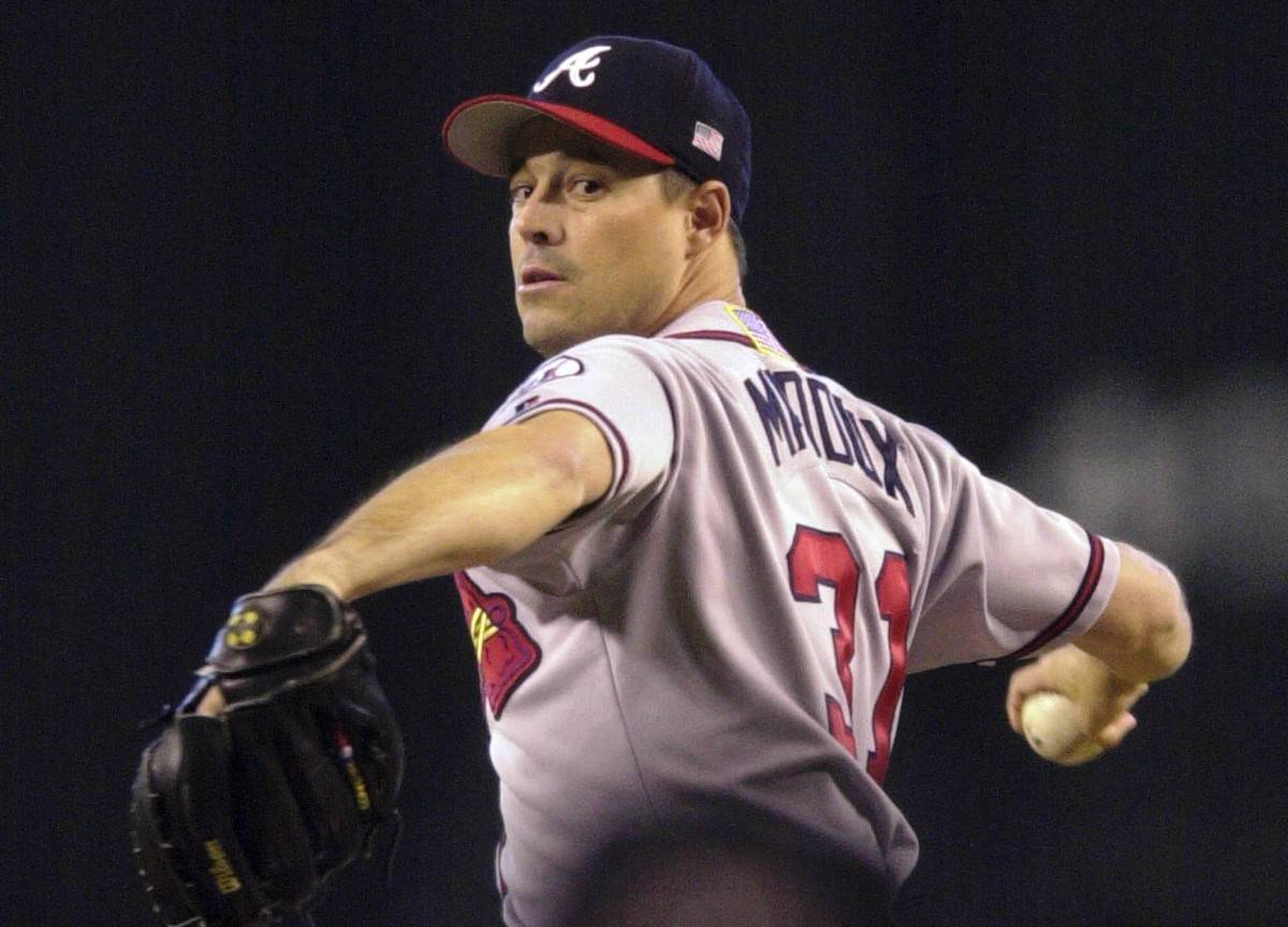 Atlanta Braves starting pitcher Greg Maddux delivers against the Arizona Diamondbacks in the fi ...