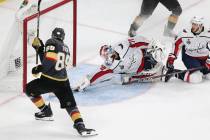 Washington Capitals goaltender Braden Holtby (70) defends a shot by Vegas Golden Knights right ...