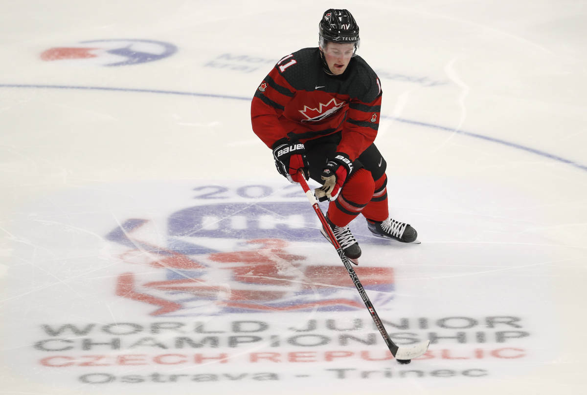 Canada's Alexis Lafreniere controls the puck during the U20 Ice Hockey Worlds match between Can ...