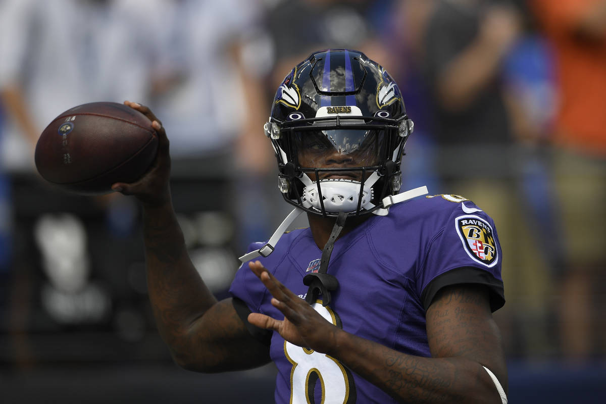 Baltimore Ravens quarterback Lamar Jackson (8) warms up prior to an NFL football game against t ...