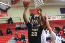 Clark's Antwon Jackson (23) shoots past Desert Pines' Jamir Stephens (33) during the second hal ...