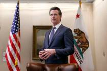 Gov. Gavin Newsom talks with reporters at his office in Sacramento, Calif., in 2019. (AP Photo/ ...