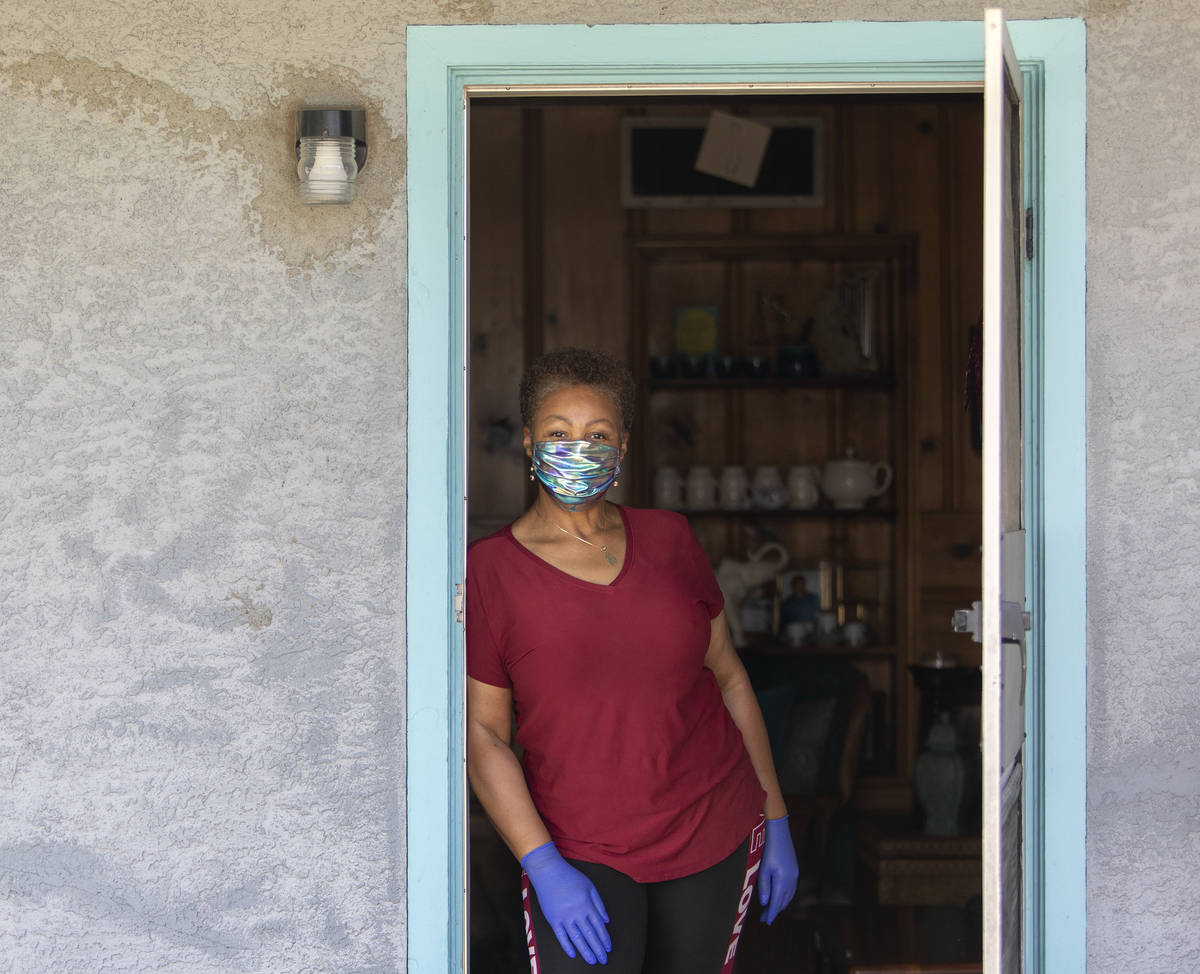 Kismet Evans stand for a portrait in her doorway on Thursday, April 16, 2020, in Las Vegas. Eva ...