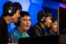 Xiao Wang, left, and Jian Zihao, second from left, known together as UziGod, play tandem League ...