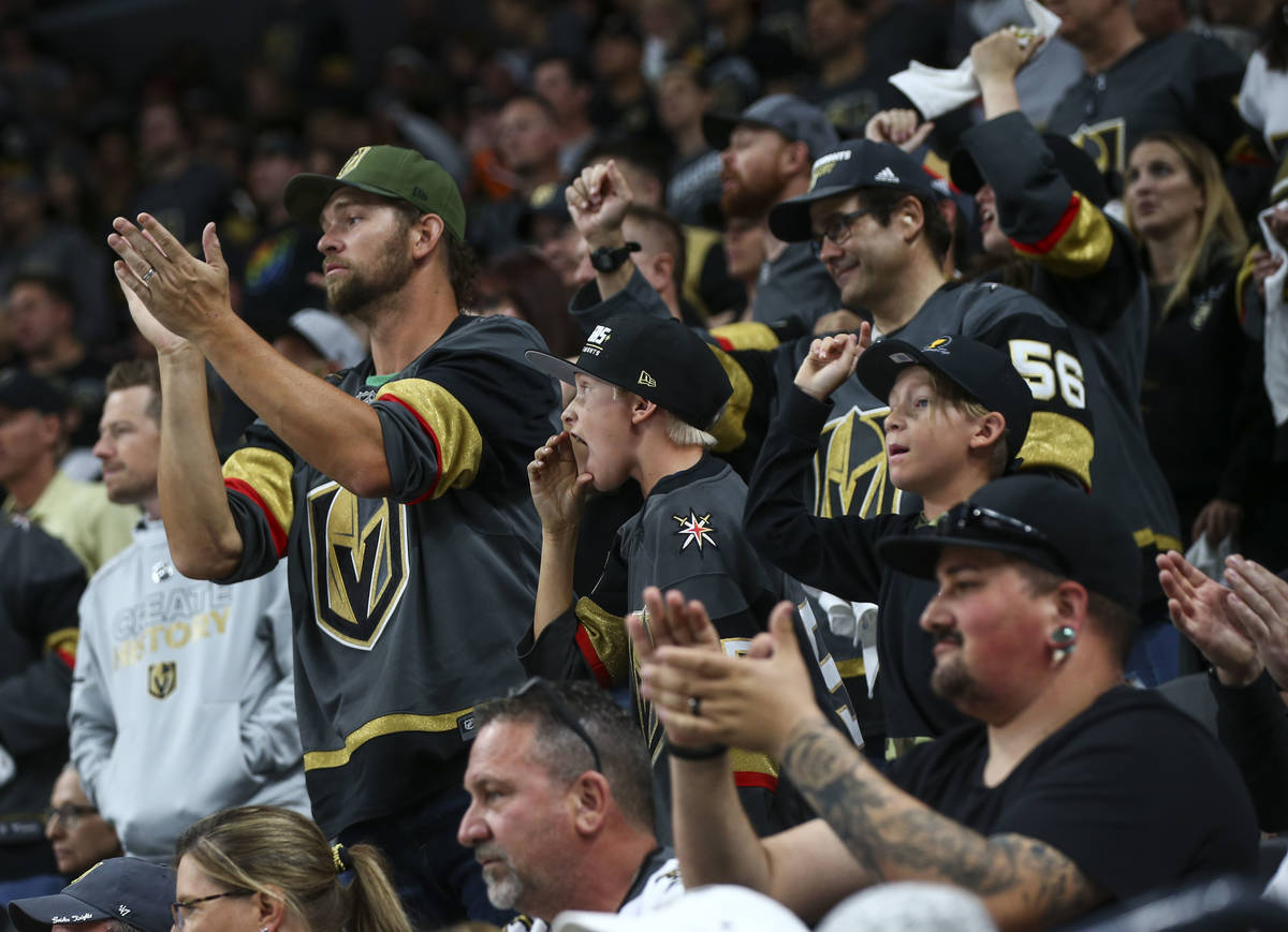 Golden Knights fans shout to Los Angeles Kings players during the second period of Game 1 of an ...