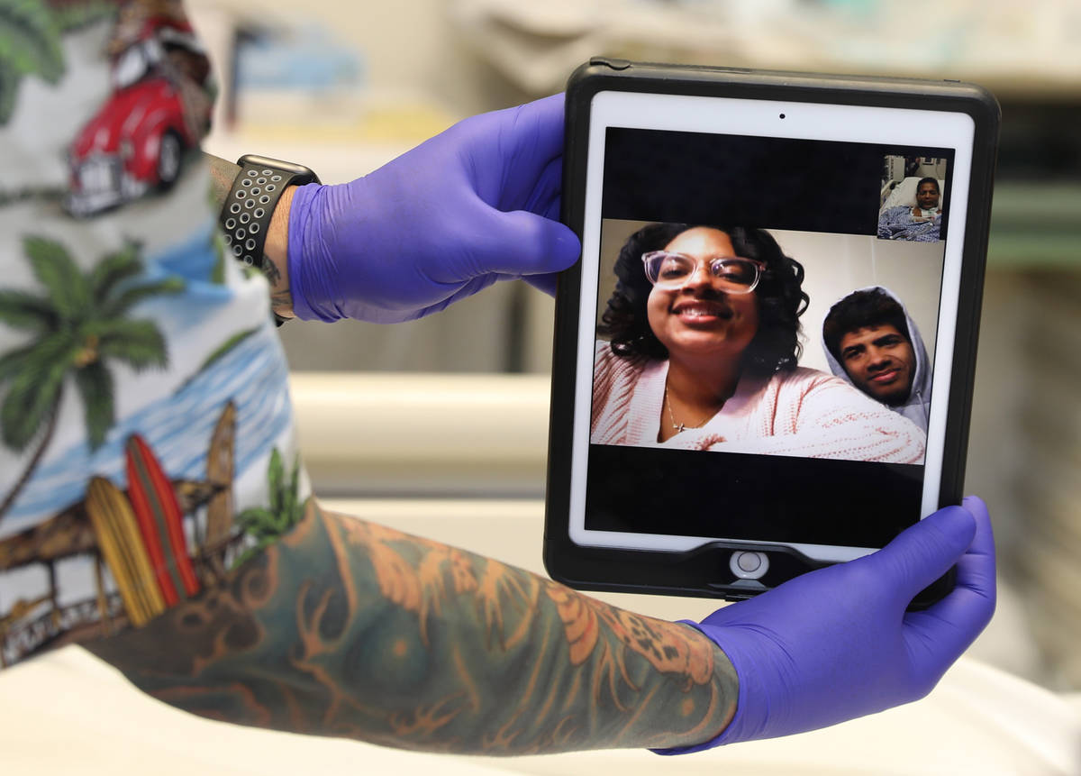 Former Marine Pvt. Ronald Pipkins, 55, Facetimes with his kids, Jaela and Ronald, as he recover ...