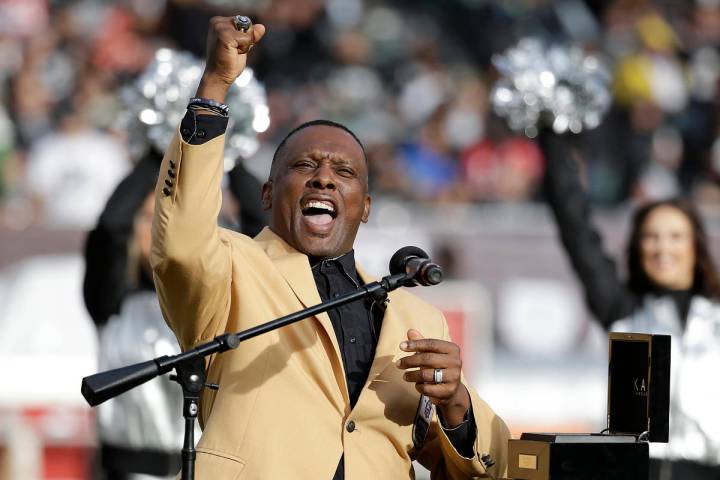 Former Oakland Raiders wide receiver Tim Brown gestures while speaking at a ceremony honoring h ...