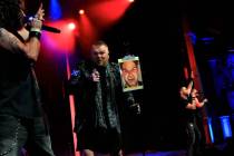 Jimmy Denning of Tenors of Rock shows a photo of bandmate Tommy Sherlock during the act's final ...