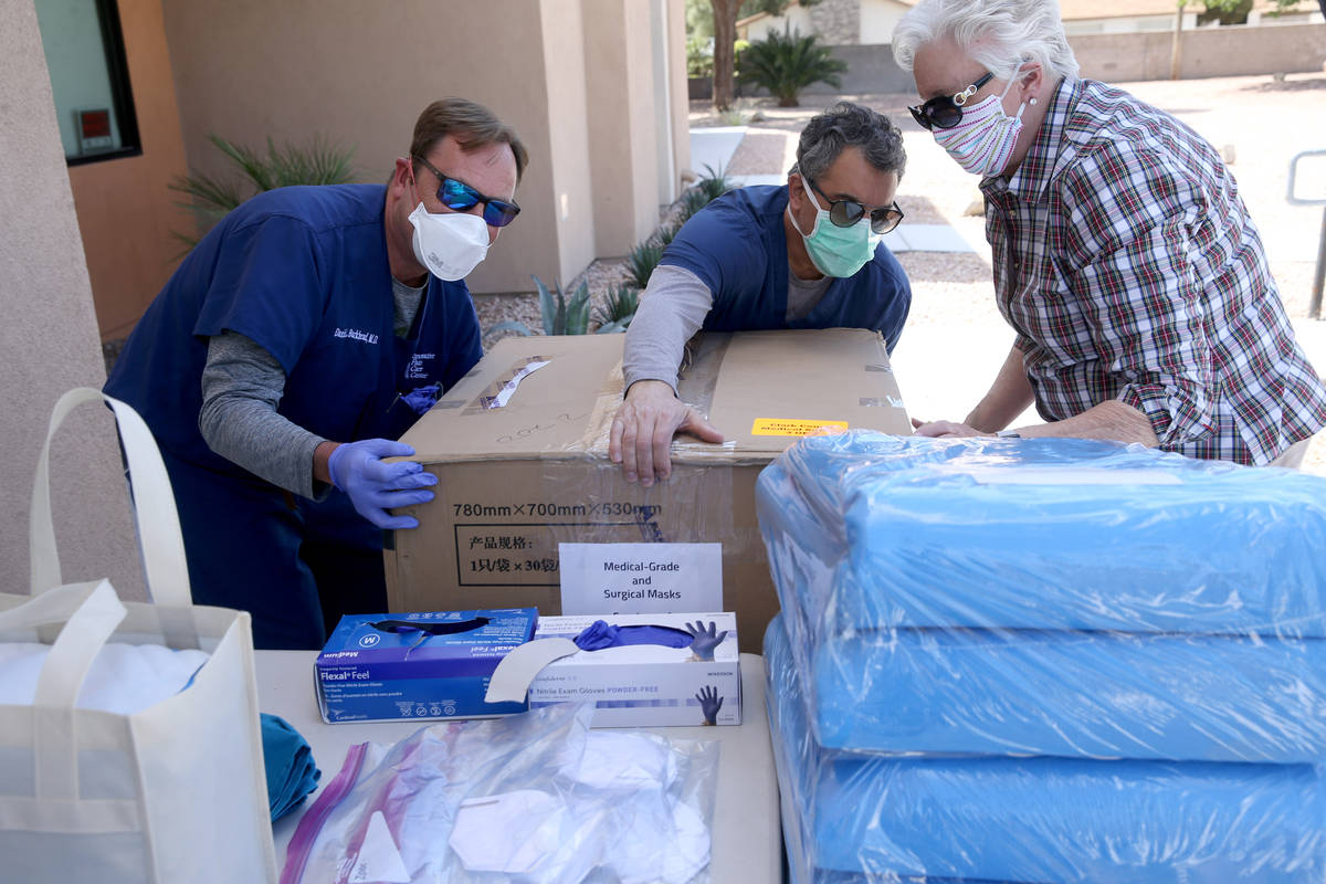 Dr. Daniel Burkhead, from left, Dr. Nicholas Fiore and Denise Selleck, executive director of Cl ...