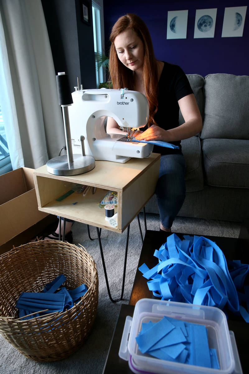 Heather Shaw, 26, makes medical masks as part of the Mask Task Force, a partnership between the ...