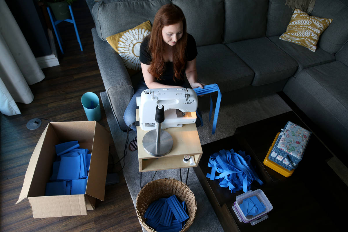 Heather Shaw, 26, makes medical masks as part of the Mask Task Force, a partnership between the ...