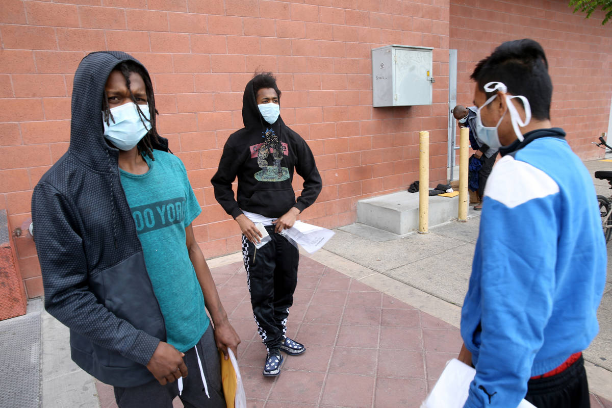 Terry Whitehead, 21, from left, Tai-Ree Williams, 22, and John Ricaza, 28, are released from th ...