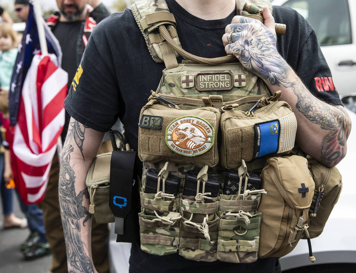 A protester wears tactical gear holding magazine clips during an event organized by Reopen Neva ...