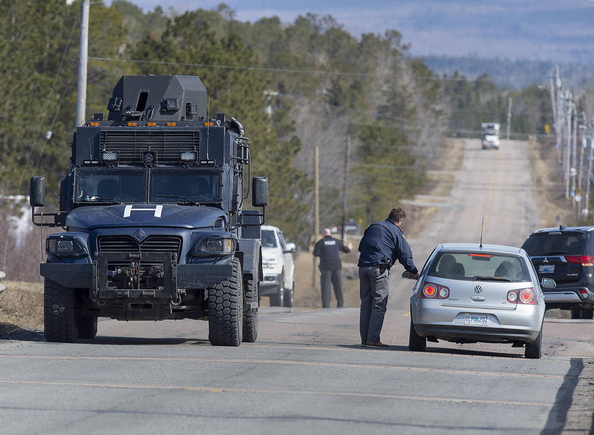 Police block the highway in Debert, Nova Scotia on Sunday, April 19, 2020. Canadian police arre ...