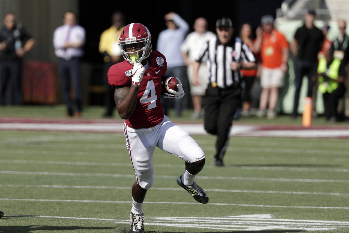 Alabama wide receiver Jerry Jeudy (4) runs after a reception against Michigan during the first ...