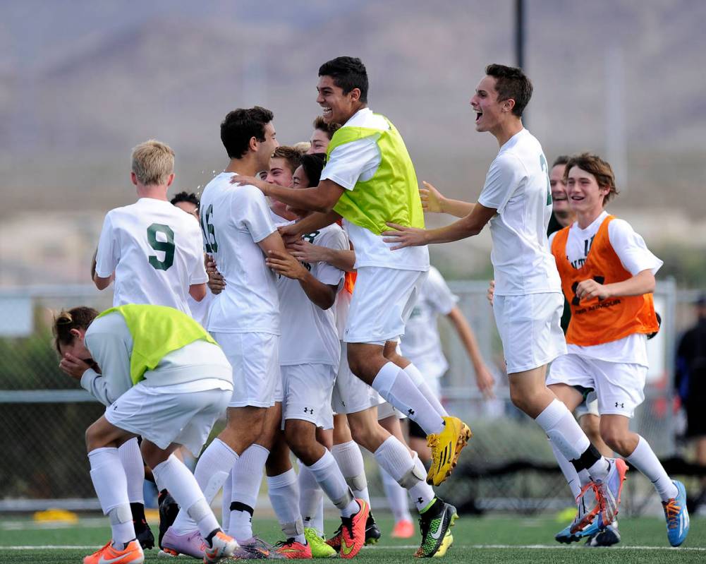 Palo Verde players celebrate their 2-1 victory over Valley in the Division I boys state soccer ...