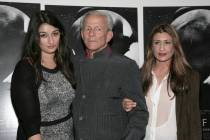 FILE - This June 20, 2013 file photo shows, photographer Peter Beard, flanked by Zara Beard, l ...