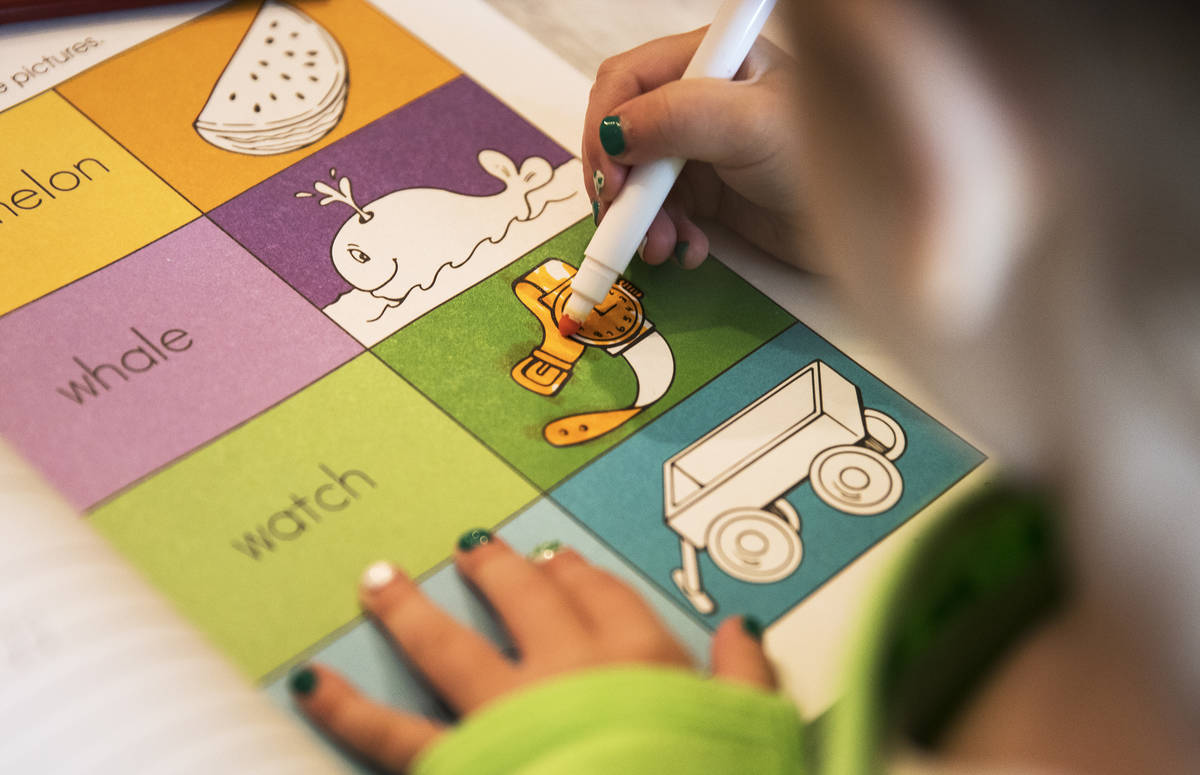 Angie Doleshal, 3, colors at her home in Henderson, Tuesday, March 17, 2020. Clark County Schoo ...