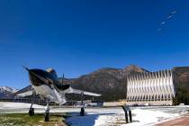 Four F-35A fighter jets fly over the Air Force Academy in Colorado Springs, Colo., Friday, Apri ...