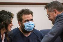 Joshua Nichols, center, confers with his lawyers Julie Raye, left, and Robert Draskovich during ...