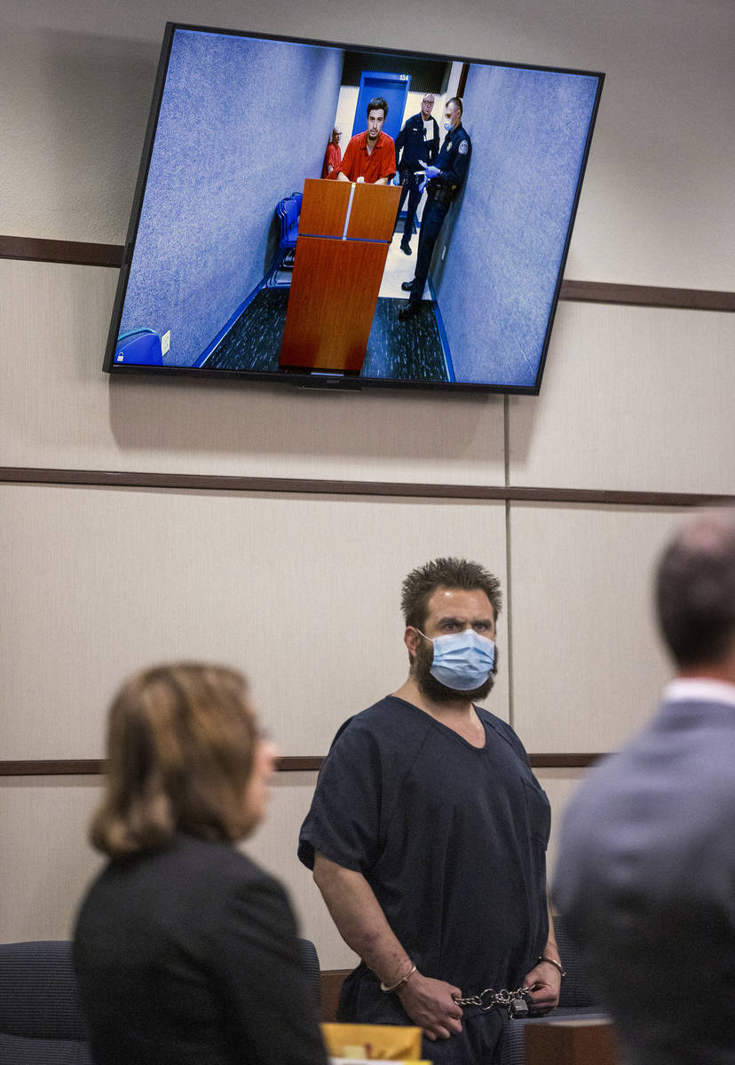 Joshua Nichols, center, appears with co-defendant George Moya on video feed, above, during thei ...