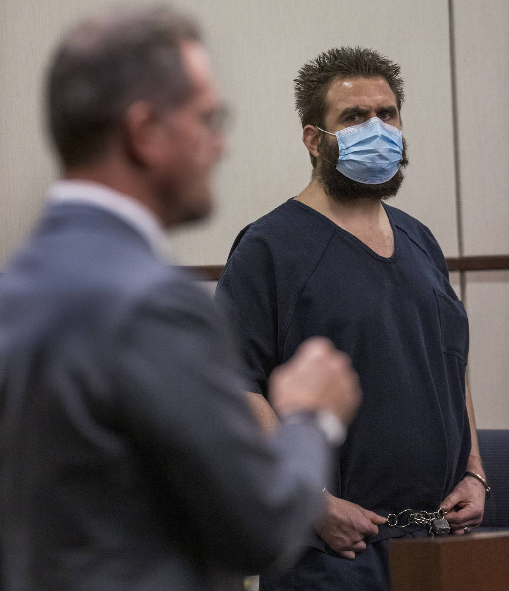 Joshua Nichols, right, listens to his lawyer Robert Draskovich, right, during his hearing at He ...