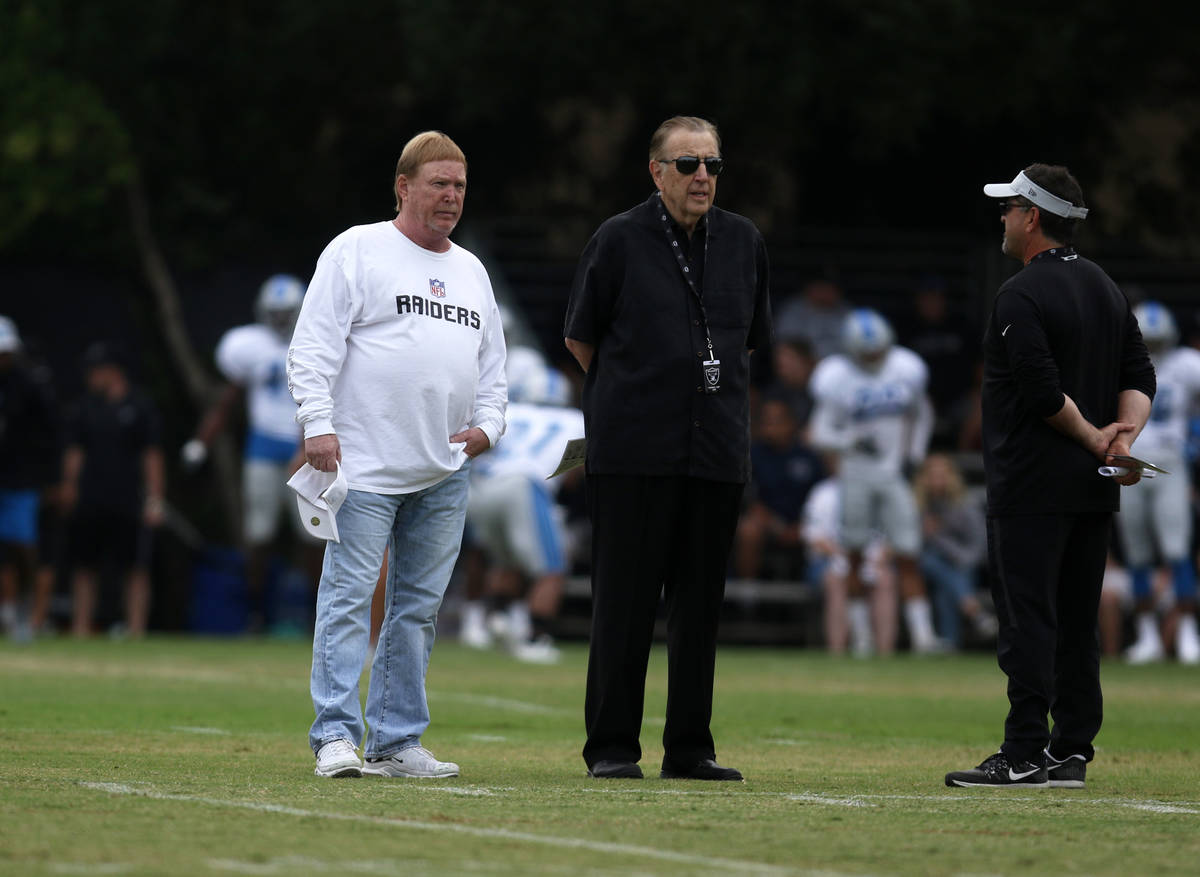 Oakland Raiders owner Mark Davis, left, attends practice with Oakland Raiders play-by-play radi ...