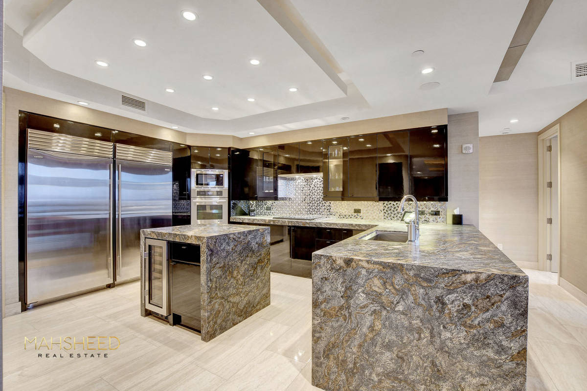 The chef’s kitchen features a Jenn-Air double oven, Subzero refrigerator, freezer wine chille ...