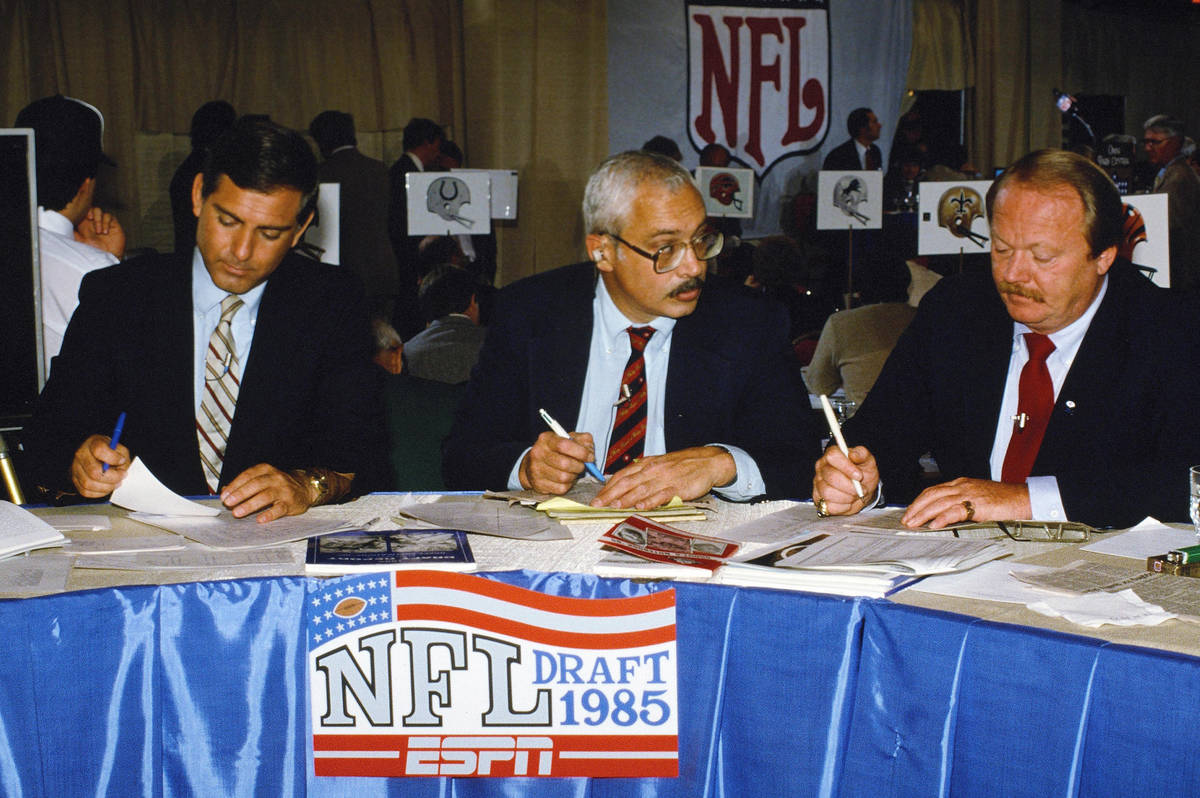 Former Buffalo Bills linebacker Paul Maguire (R) works the ESPN draft table with Sports Illustr ...
