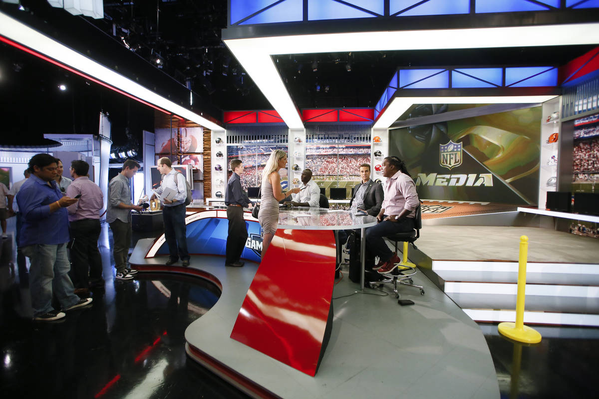 NFL Network's Terrell Davis, Daniel Jeremiah and LaVar Arrington are interviewed during a media ...