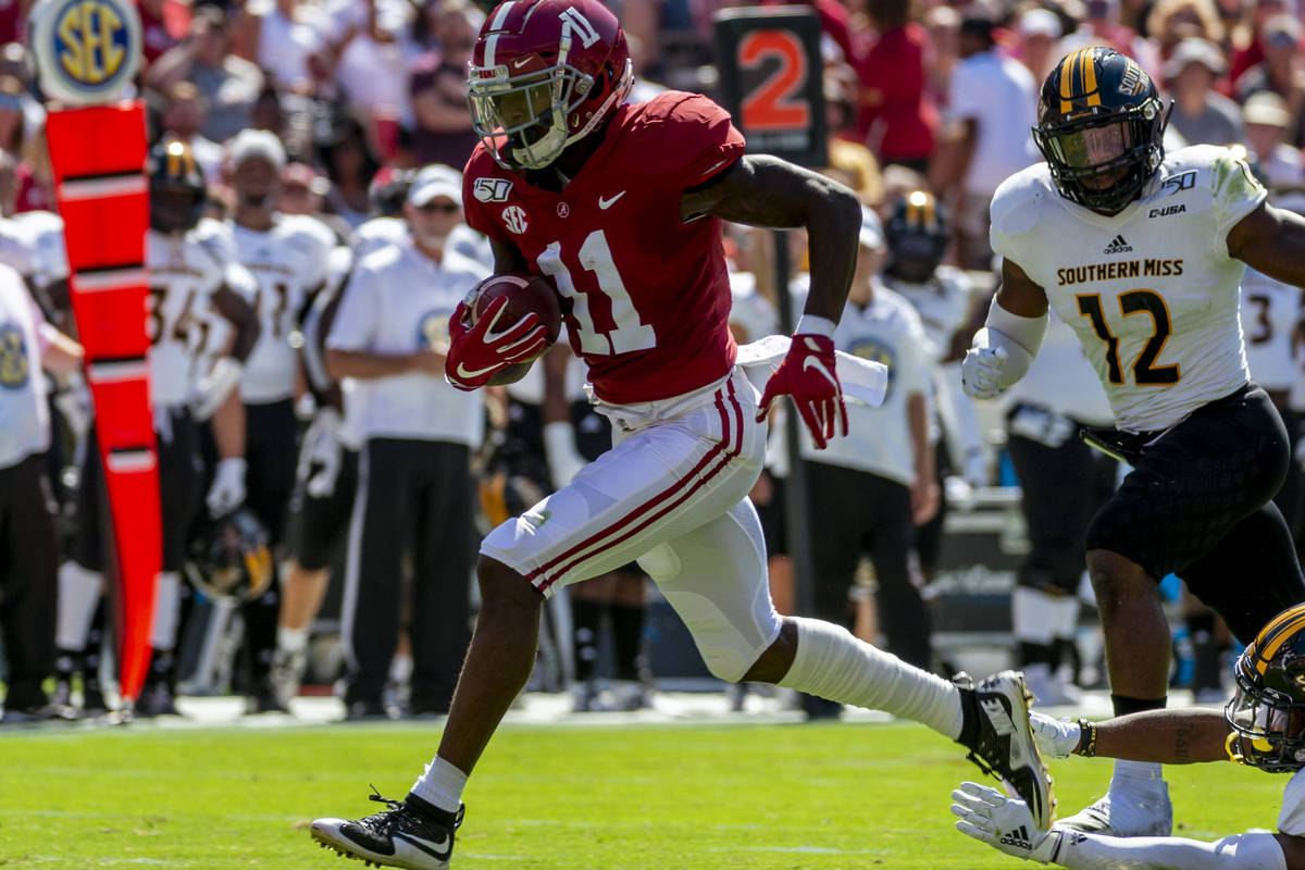 FILE - In this Sept. 21, 2019, file photo, Alabama wide receiver Henry Ruggs (11) runs in for a ...