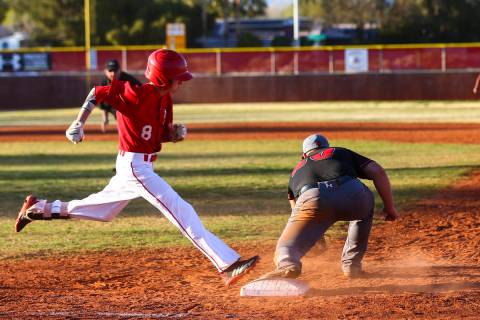 Arbor View's Payton Brooks (8) gets tagged out by Las Vegas' Trevor Johnson during a baseball g ...