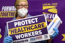 Personal health care worker Barbara Polinsky poses after receiving medical masks at SEIU Local ...