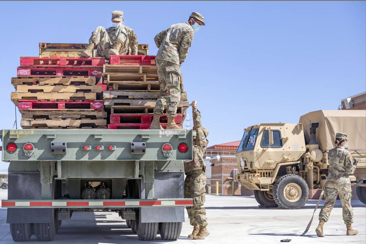 Nevada National Guardsmen recover pallets used to deliver personal protective equipment to nurs ...